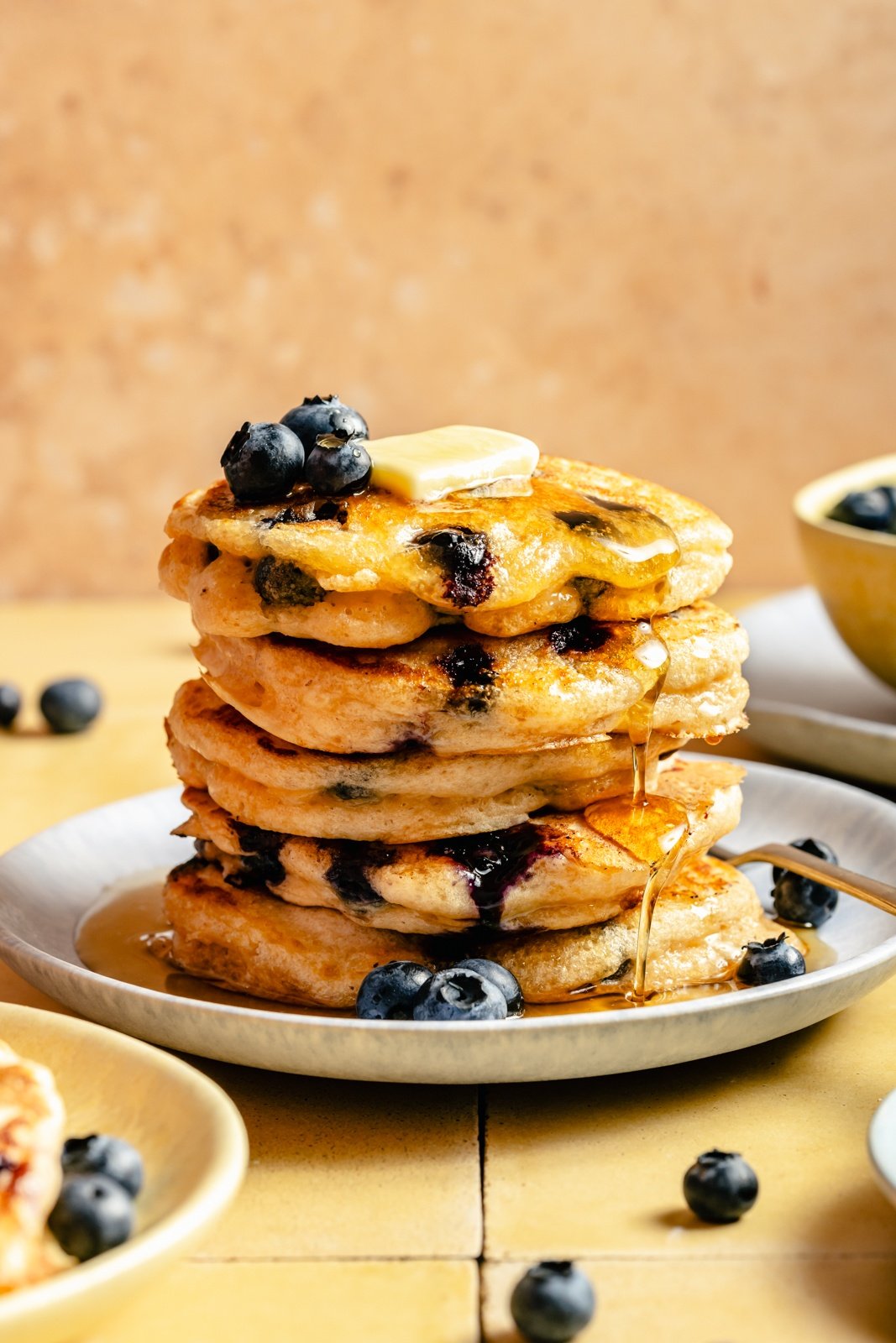 buttermilk blueberry pancakes in a stack on a plate